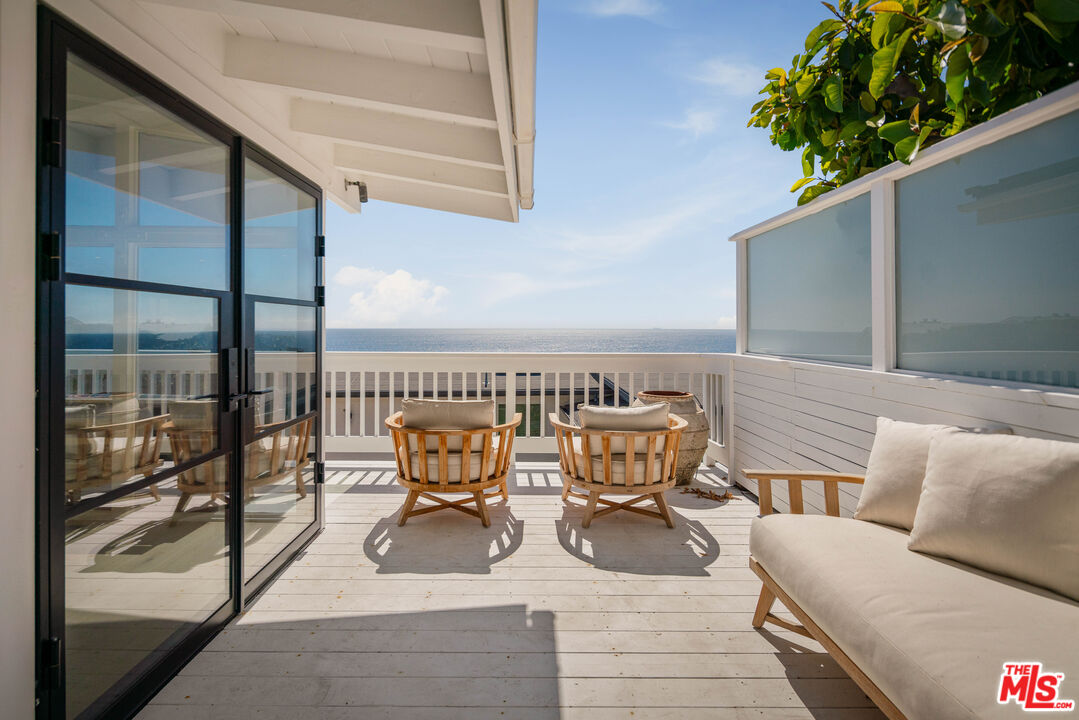 29500 Heathercliff Road, Unit 138 Malibu, CA 90265 - Photo 16 of 20 a view of a balcony with chairs