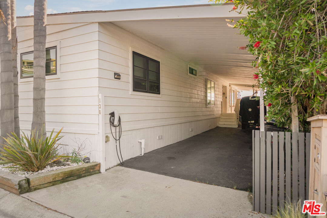29500 Heathercliff Road, Unit 138 Malibu, CA 90265 - Photo 18 of 20 a view of a house with a backyard