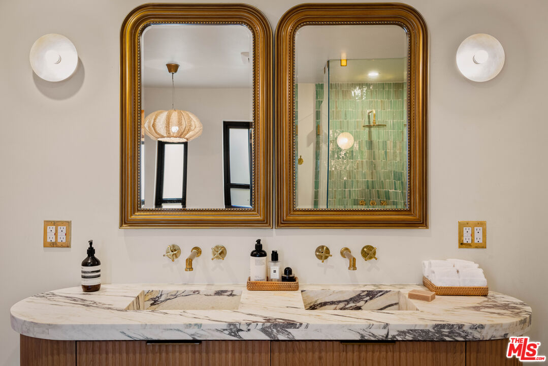 29500 Heathercliff Road, Unit 138 Malibu, CA 90265 - Photo 10 of 20 a bathroom with sinks and mirror