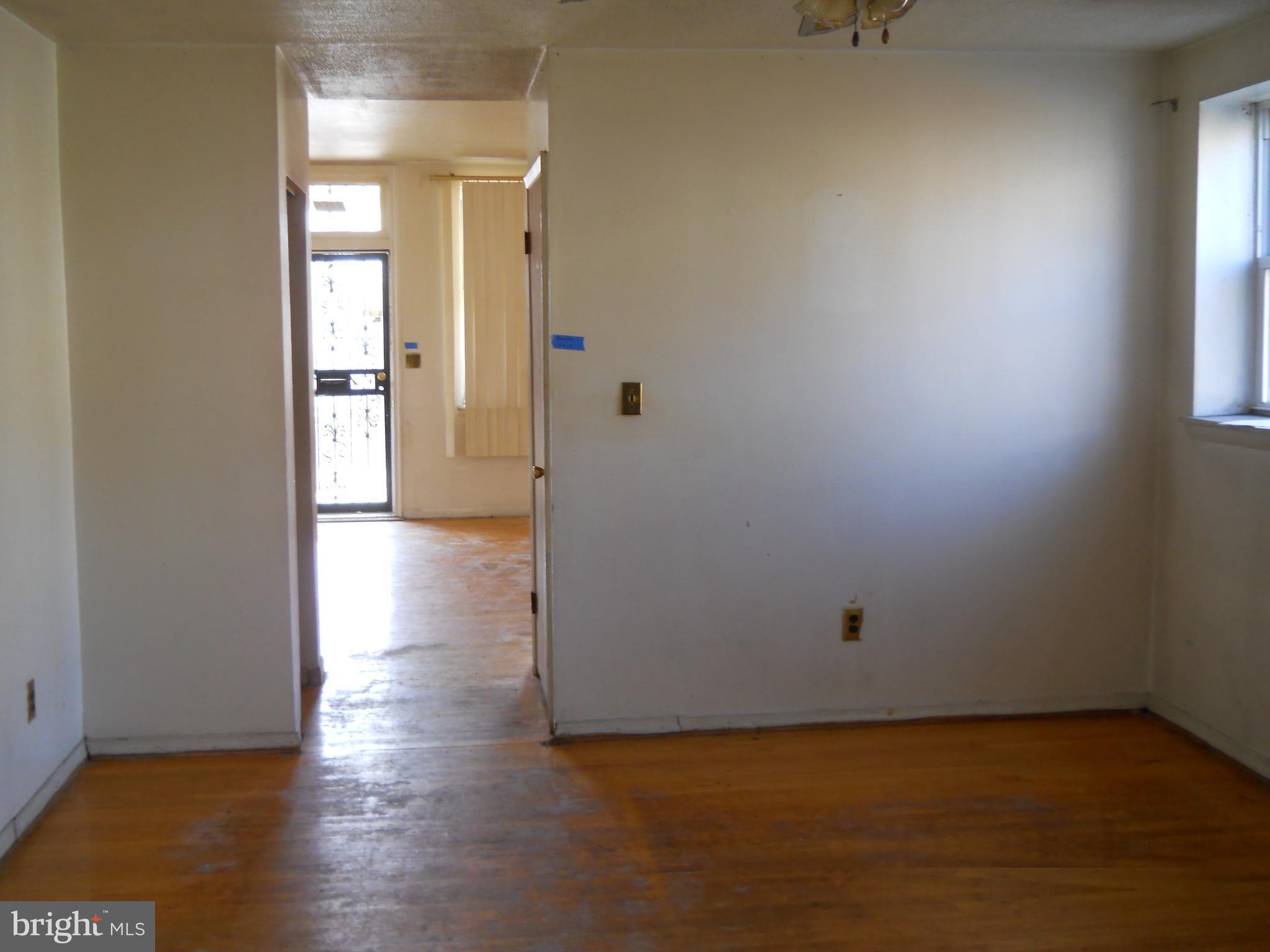 3755 Reisterstown Road Baltimore, MD 21215 - Photo 3 of 11 a view of a room with wooden floor and a window