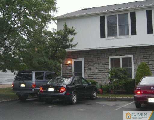 4701 Hana Road Edison, NJ 08817 - Photo 1 of 8 a car parked in front of a house