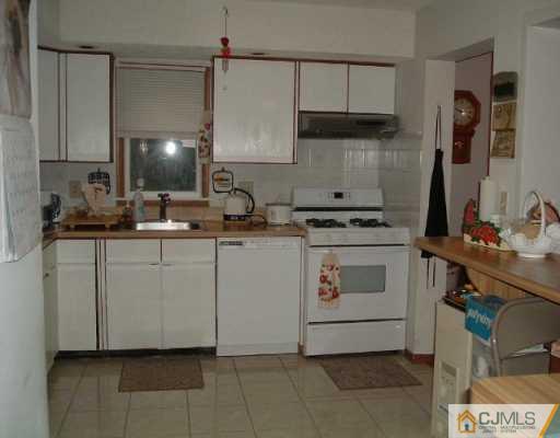 4701 Hana Road Edison, NJ 08817 - Photo 2 of 8 a kitchen with a sink and cabinets