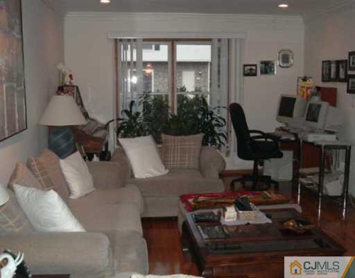 4701 Hana Road Edison, NJ 08817 - Photo 3 of 8 a living room with furniture and wooden floor