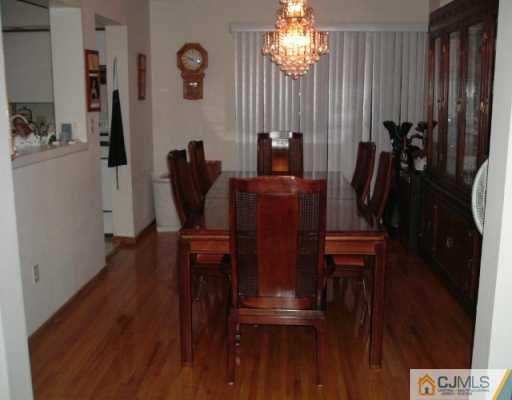 4701 Hana Road Edison, NJ 08817 - Photo 4 of 8 a view of a workspace with furniture and wooden floor