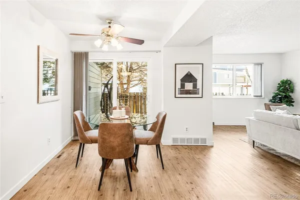 a view of a dining room with furniture window and wooden floor