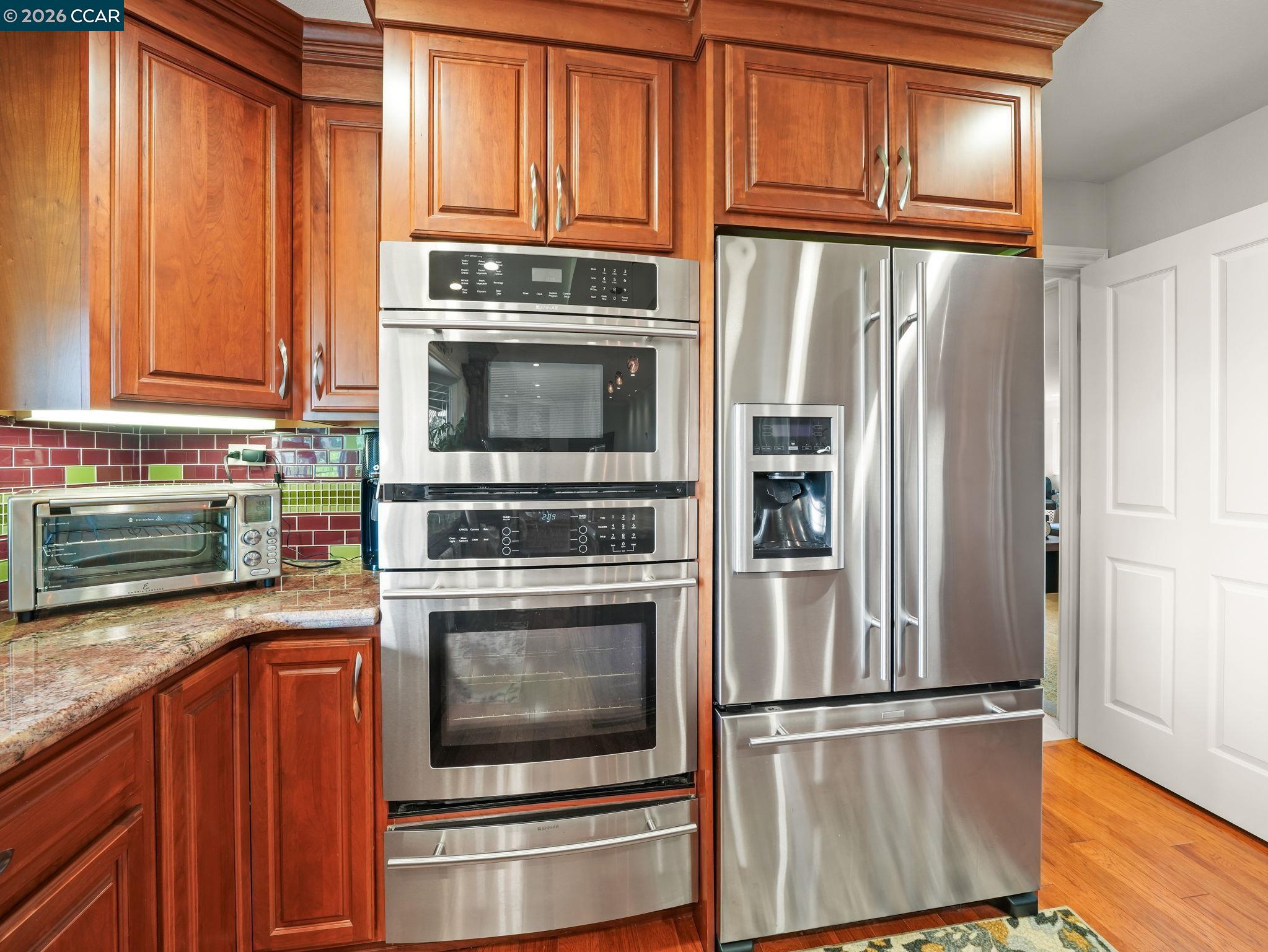 5900 High Street Clayton, CA 94517 - Photo 13 of 46 a kitchen with stainless steel appliances granite countertop a refrigerator microwave and sink