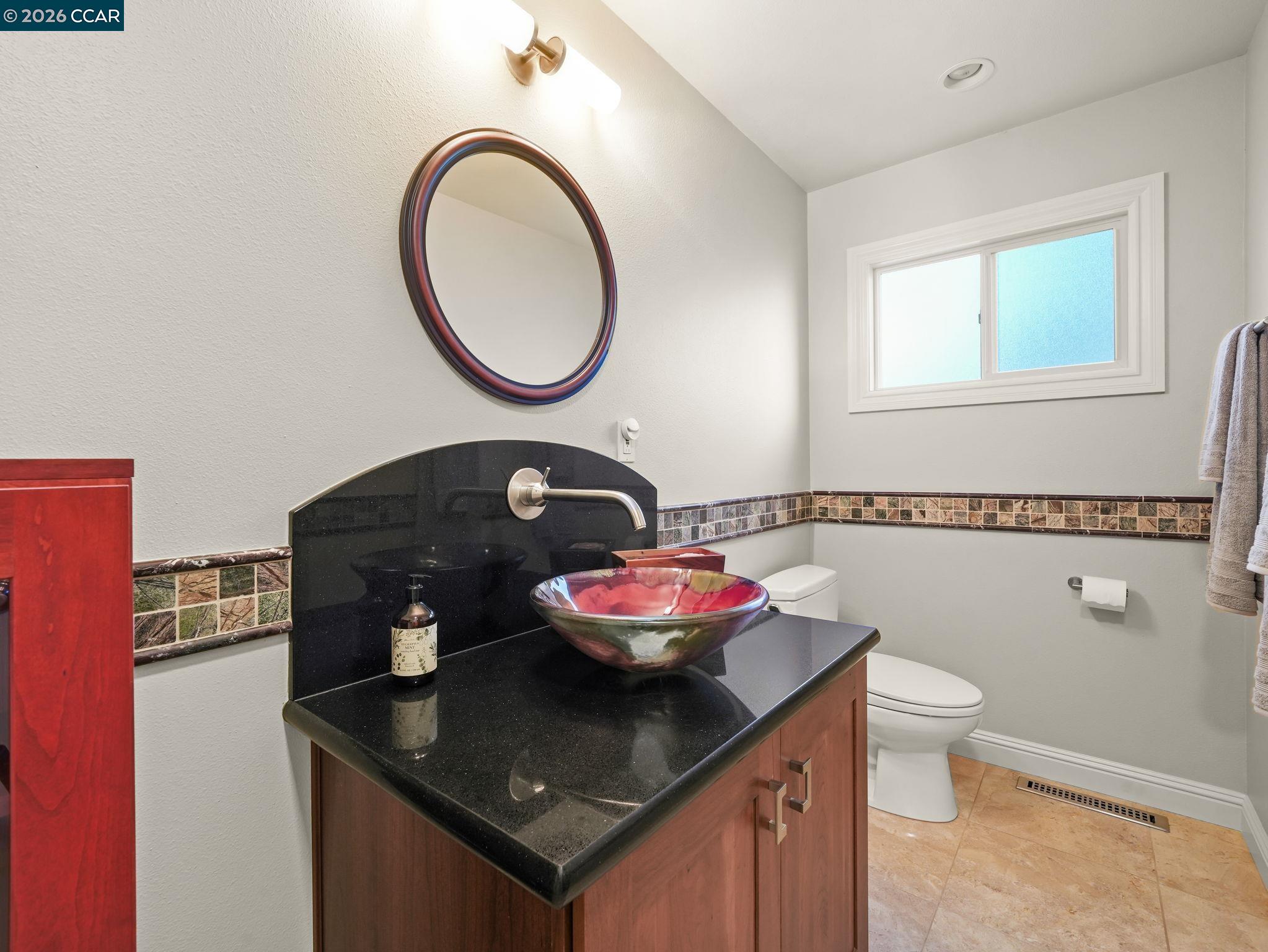 5900 High Street Clayton, CA 94517 - Photo 26 of 46 a bathroom with a granite countertop sink and a mirror