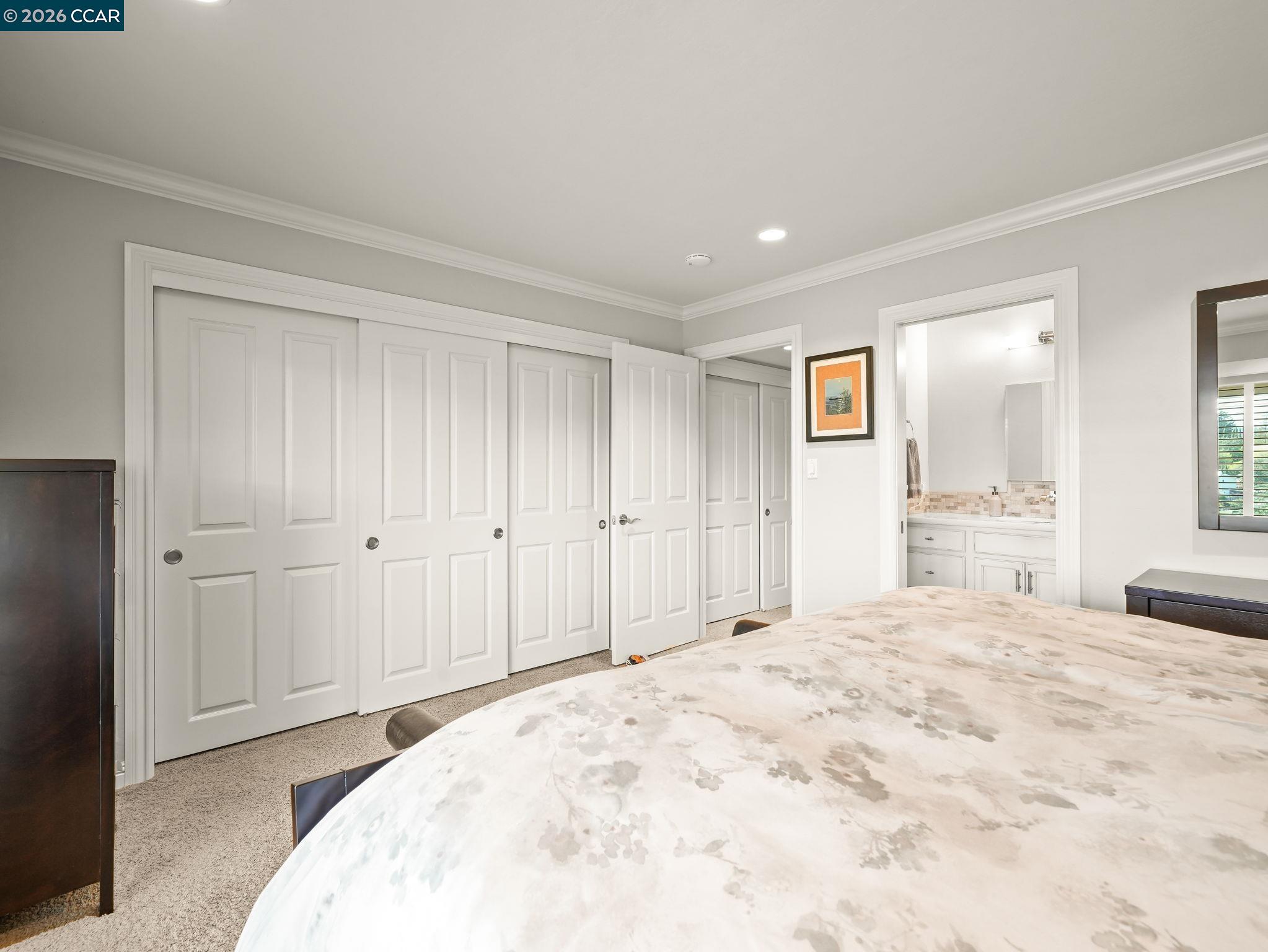 5900 High Street Clayton, CA 94517 - Photo 29 of 46 a large bedroom with a bed and a bathroom