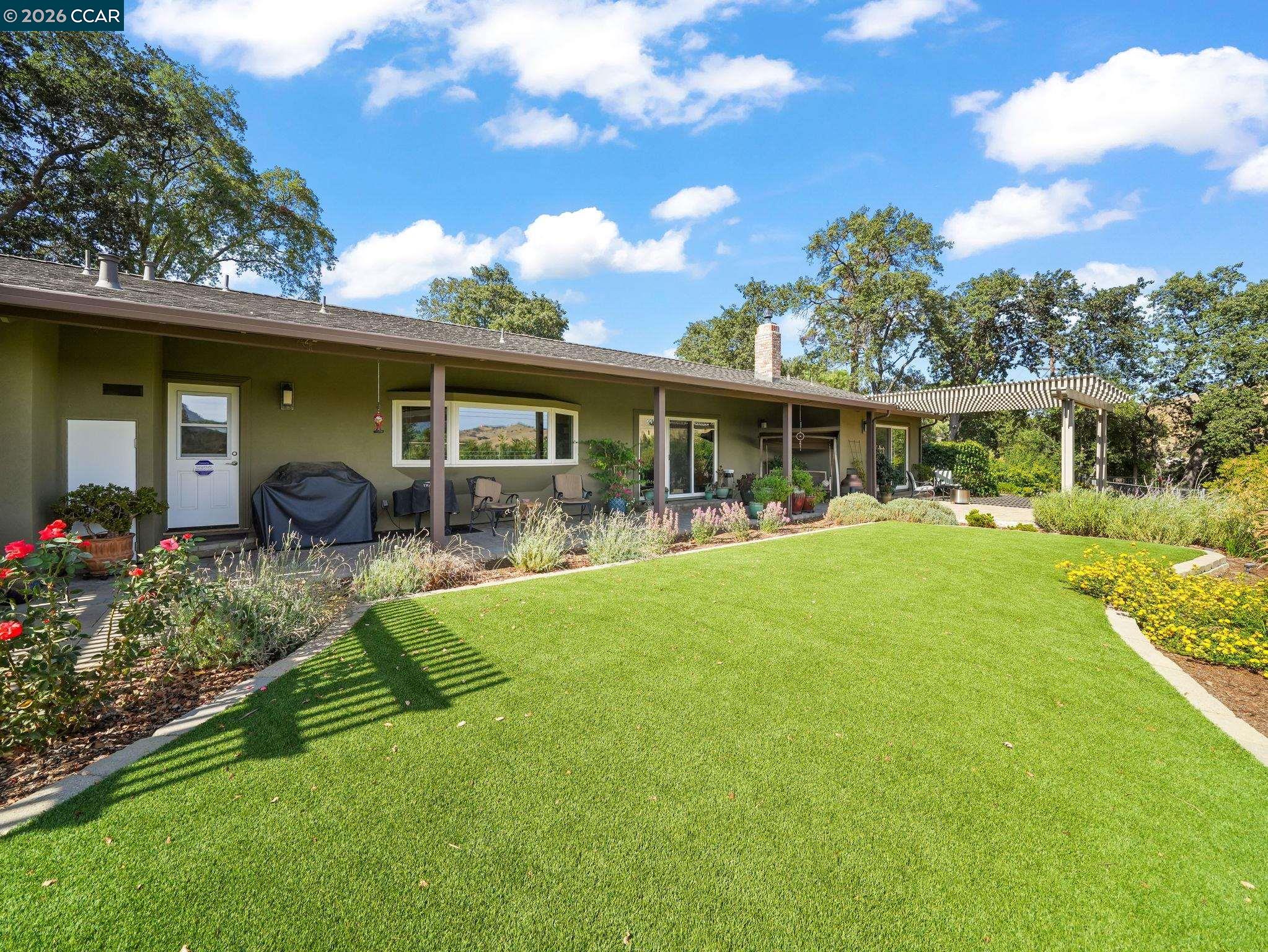 5900 High Street Clayton, CA 94517 - Photo 33 of 46 a view of a house with swimming pool and porch