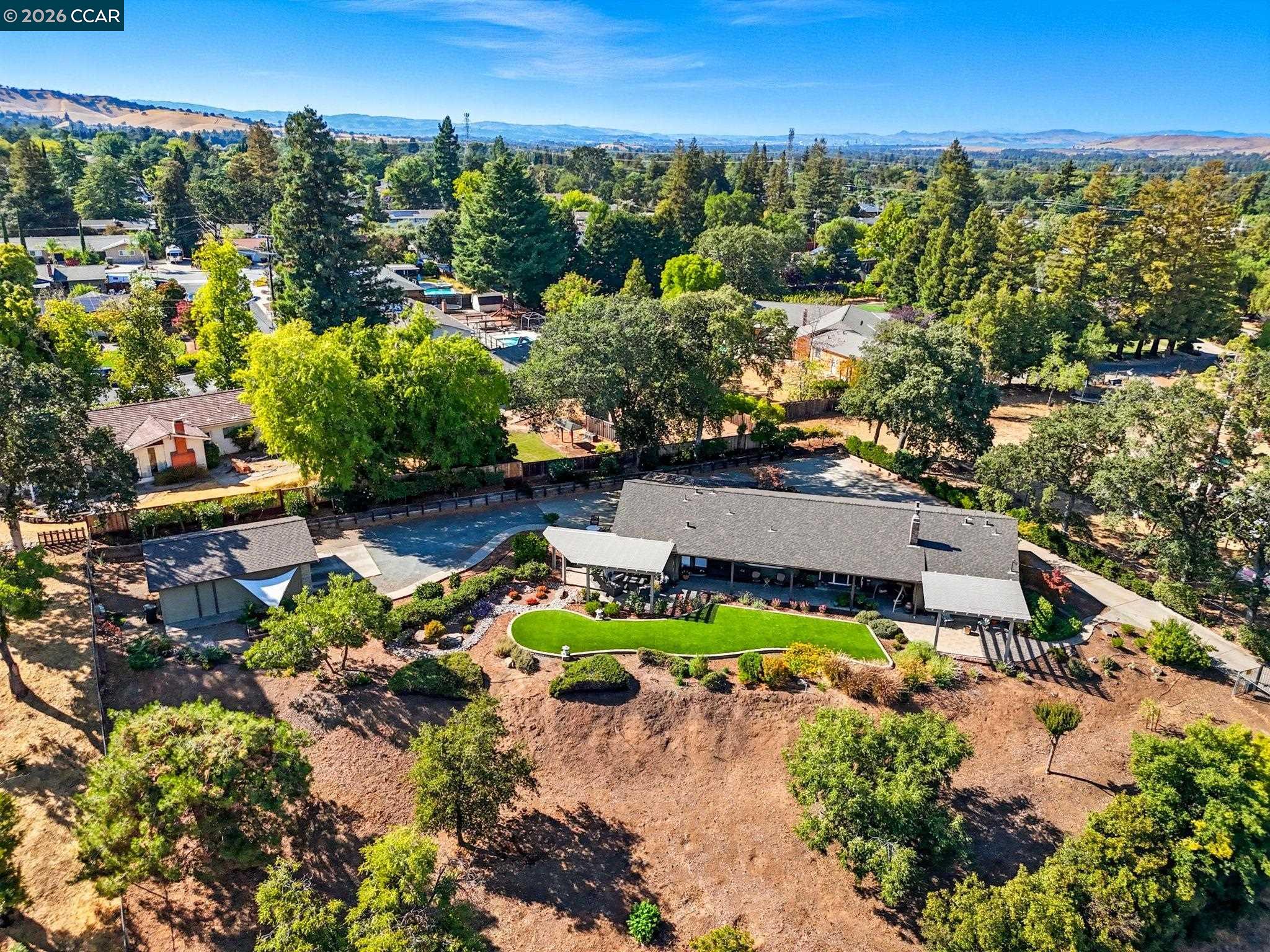 5900 High Street Clayton, CA 94517 - Photo 41 of 46 a view of a house with a garden and lake view