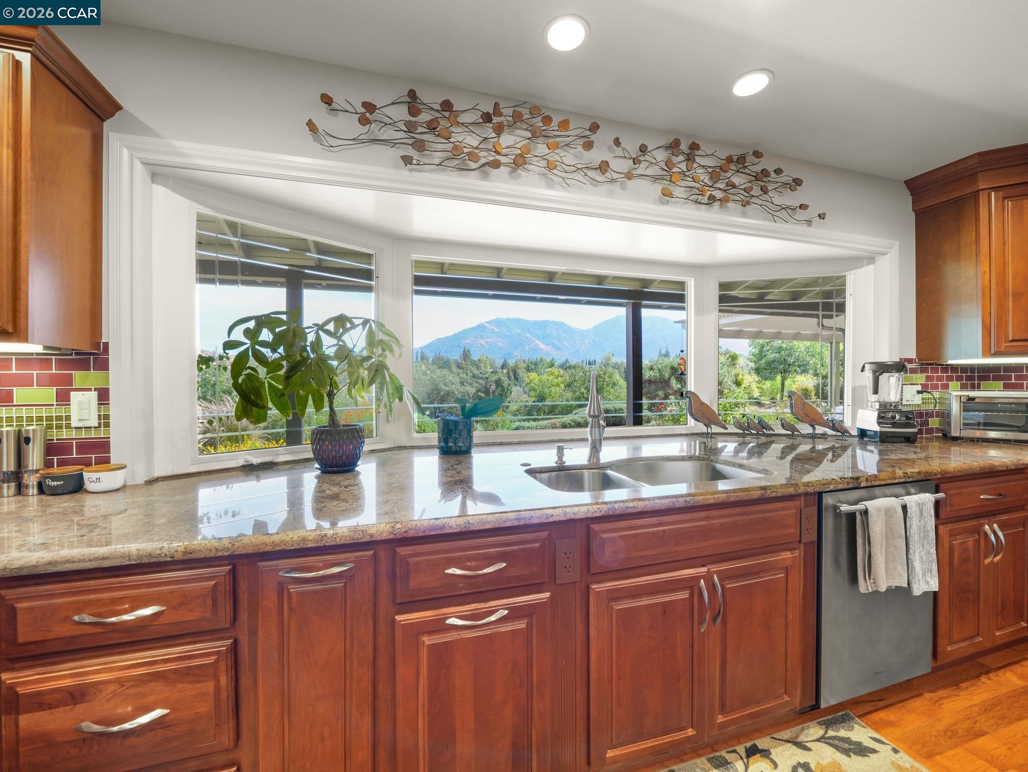 5900 High Street Clayton, CA 94517 - Photo 5 of 46 a kitchen with stainless steel appliances a sink and a large window