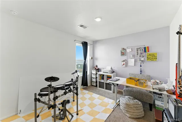 a view of a workspace with furniture and toys