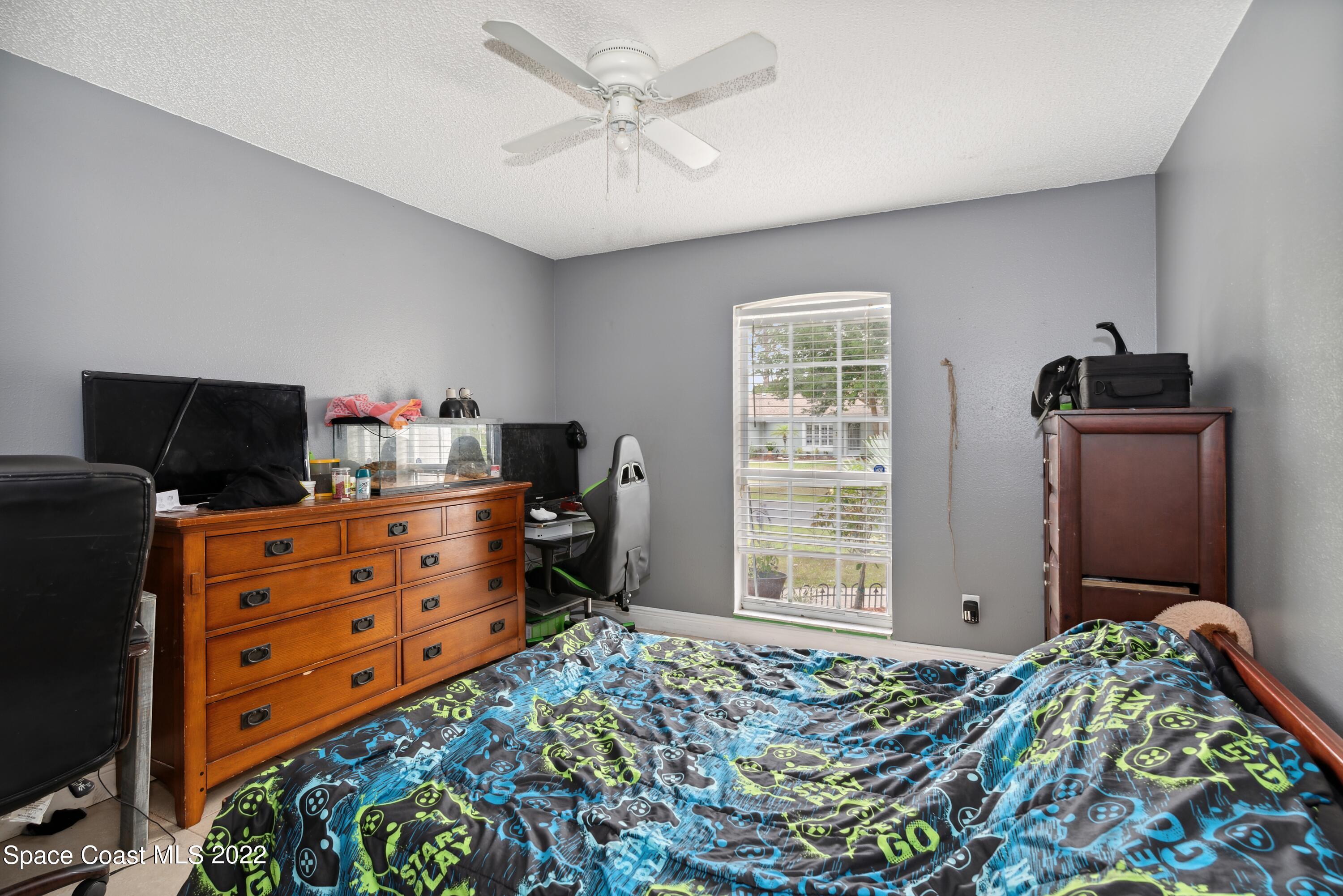 816 Tedder Road Southeast Palm Bay, FL 32909 - Photo 10 of 18 10_816TedderRd_153_2ndBedroom_HiRes