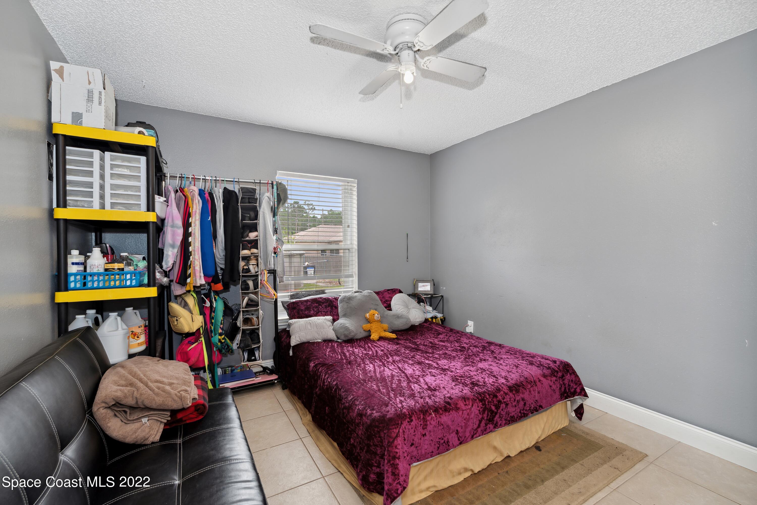 816 Tedder Road Southeast Palm Bay, FL 32909 - Photo 12 of 18 11_816TedderRd_154_3rdBedroom_HiRes