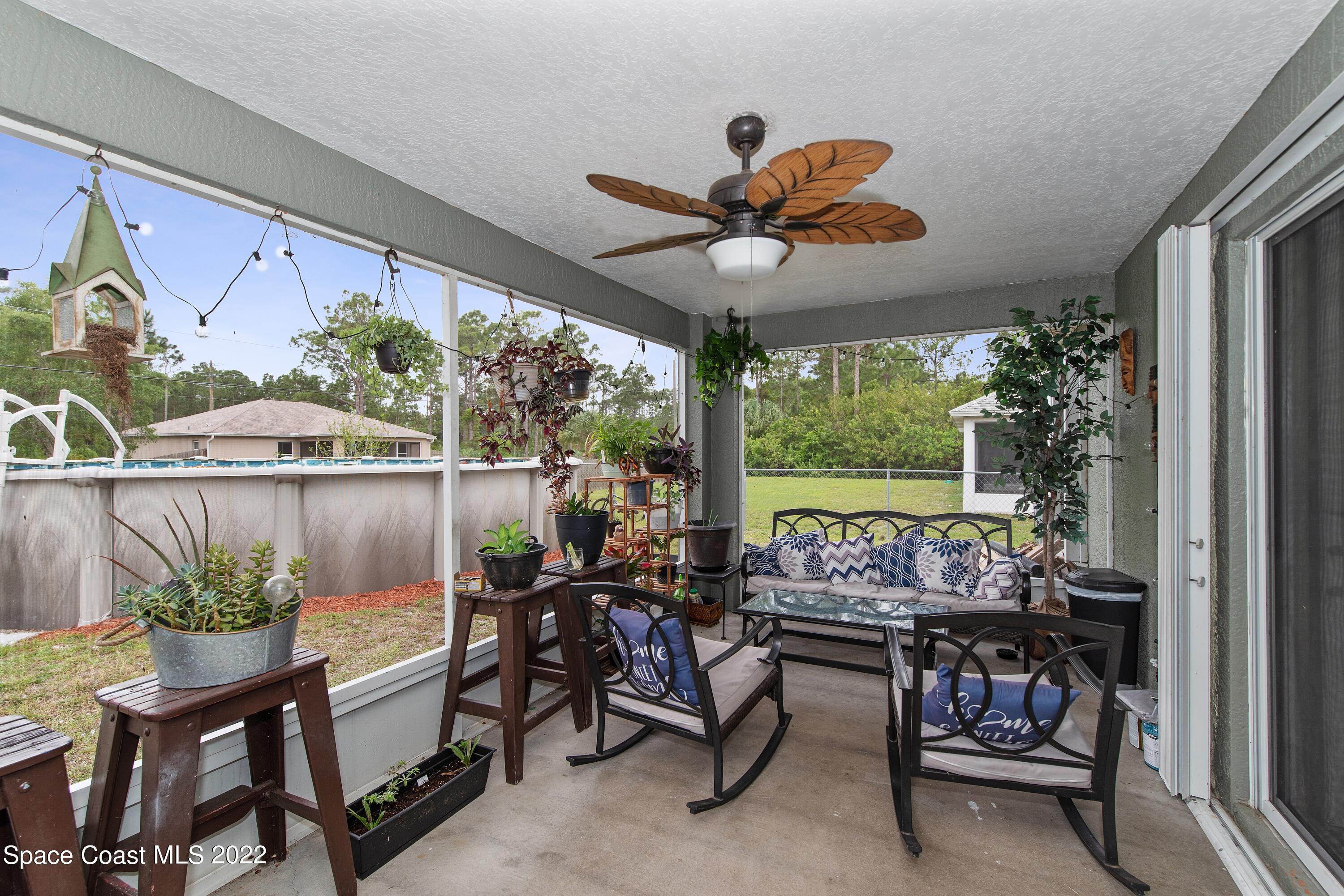 816 Tedder Road Southeast Palm Bay, FL 32909 - Photo 13 of 18 13_816TedderRd_65_Porch_HiRes
