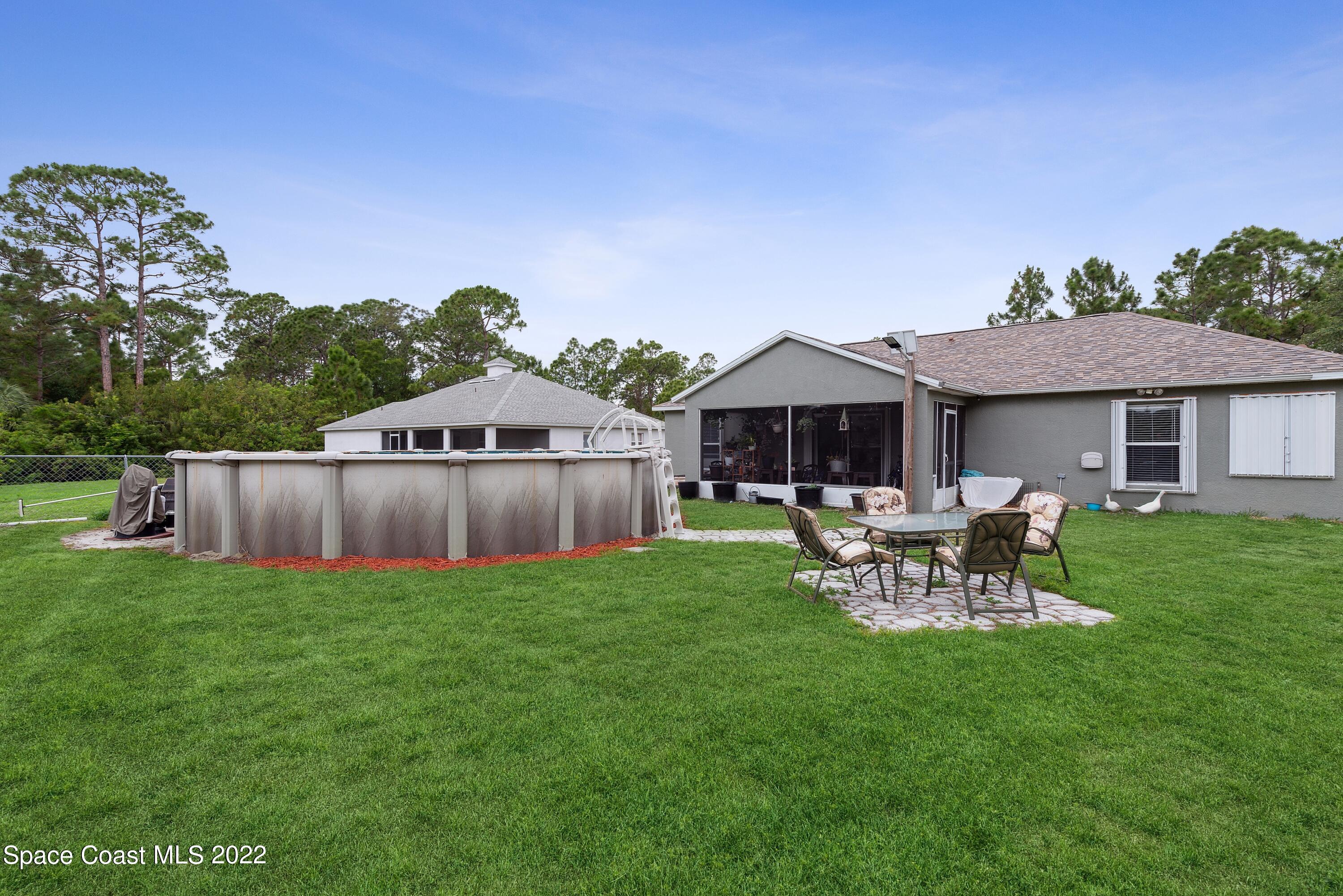 816 Tedder Road Southeast Palm Bay, FL 32909 - Photo 14 of 18 14_816TedderRd_26002_BackYard_HiRes