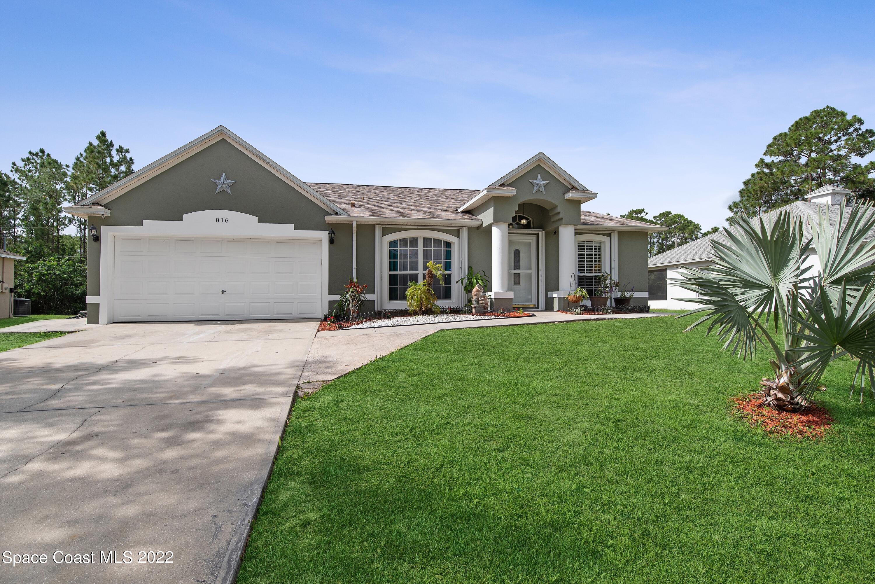 816 Tedder Road Southeast Palm Bay, FL 32909 - Photo 2 of 18 02_816TedderRd_300_FrontView_HiRes