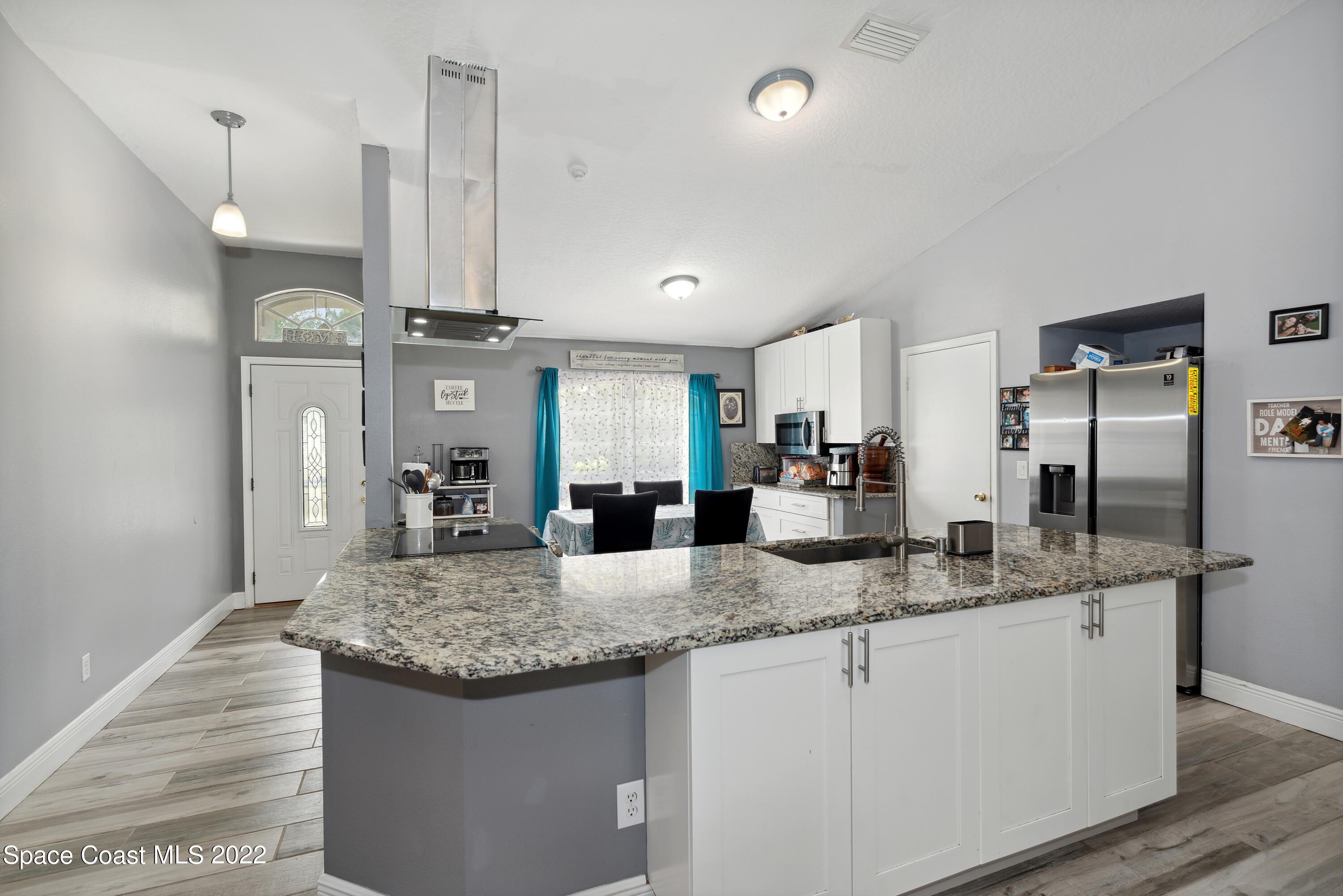 816 Tedder Road Southeast Palm Bay, FL 32909 - Photo 5 of 18 03_816TedderRd_5_Kitchen_HiRes