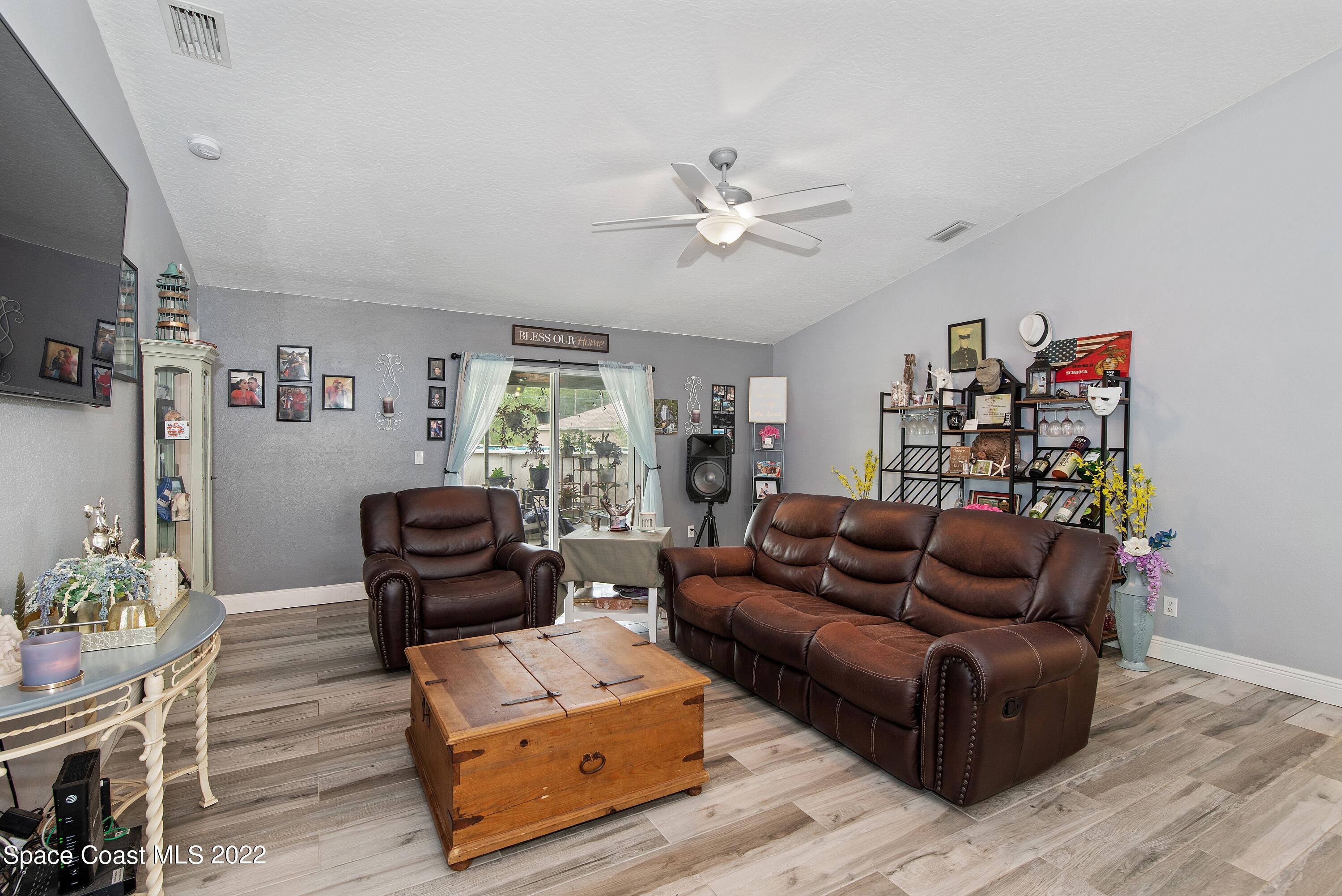 816 Tedder Road Southeast Palm Bay, FL 32909 - Photo 6 of 18 06_816TedderRd_3_FamilyRoom_HiRes