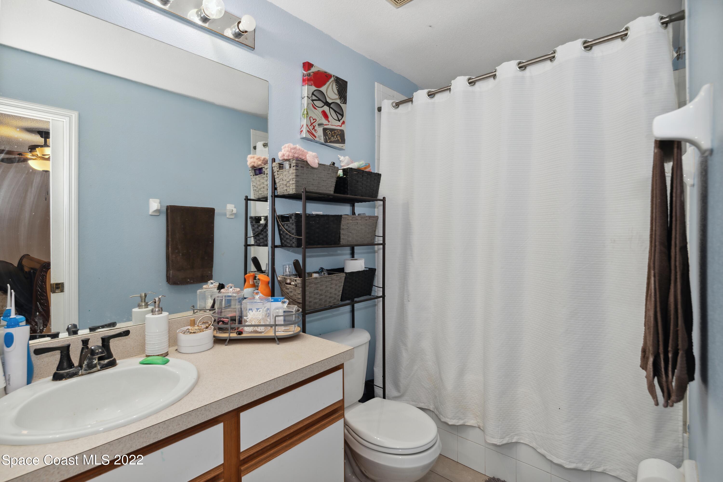 816 Tedder Road Southeast Palm Bay, FL 32909 - Photo 9 of 18 09_816TedderRd_13_PrimaryBathroom_HiRes