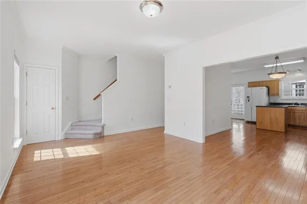 a view of a livingroom with wooden floor