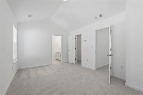 a spacious bathroom with a double vanity sink a mirror and a bathtub
