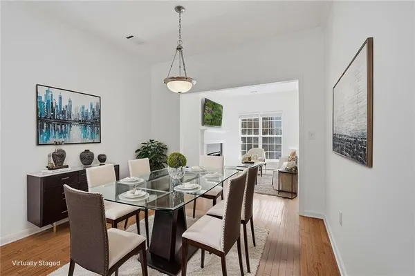 a view of a dining room with furniture window and wooden floor