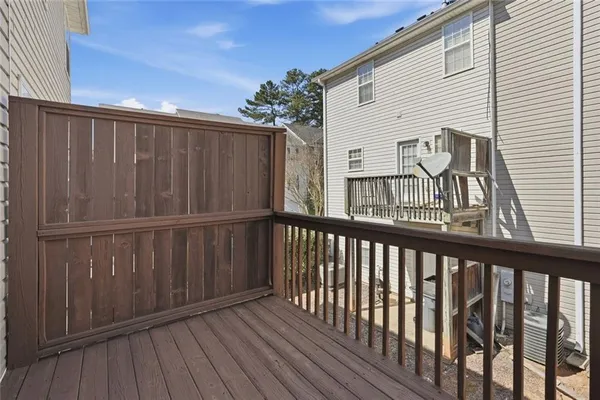 a view of a wooden deck with large windows