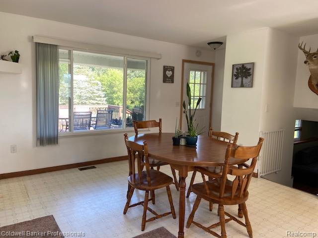 4615 5 Lakes Road North Branch, MI 48461 - Photo 6 of 27 Dining area featuring a large window overlooking the front deck