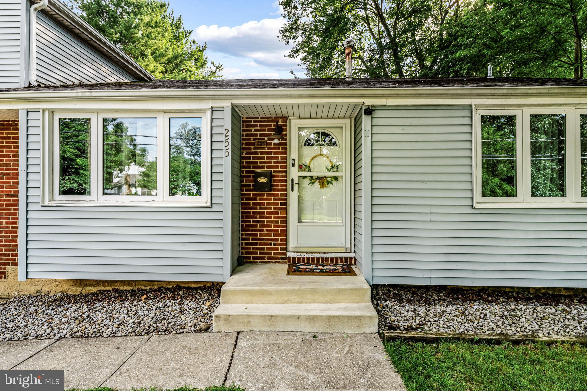 255 Jackson Road Mantua, NJ 08051 - Photo 2 of 34 a front view of a house with a garage