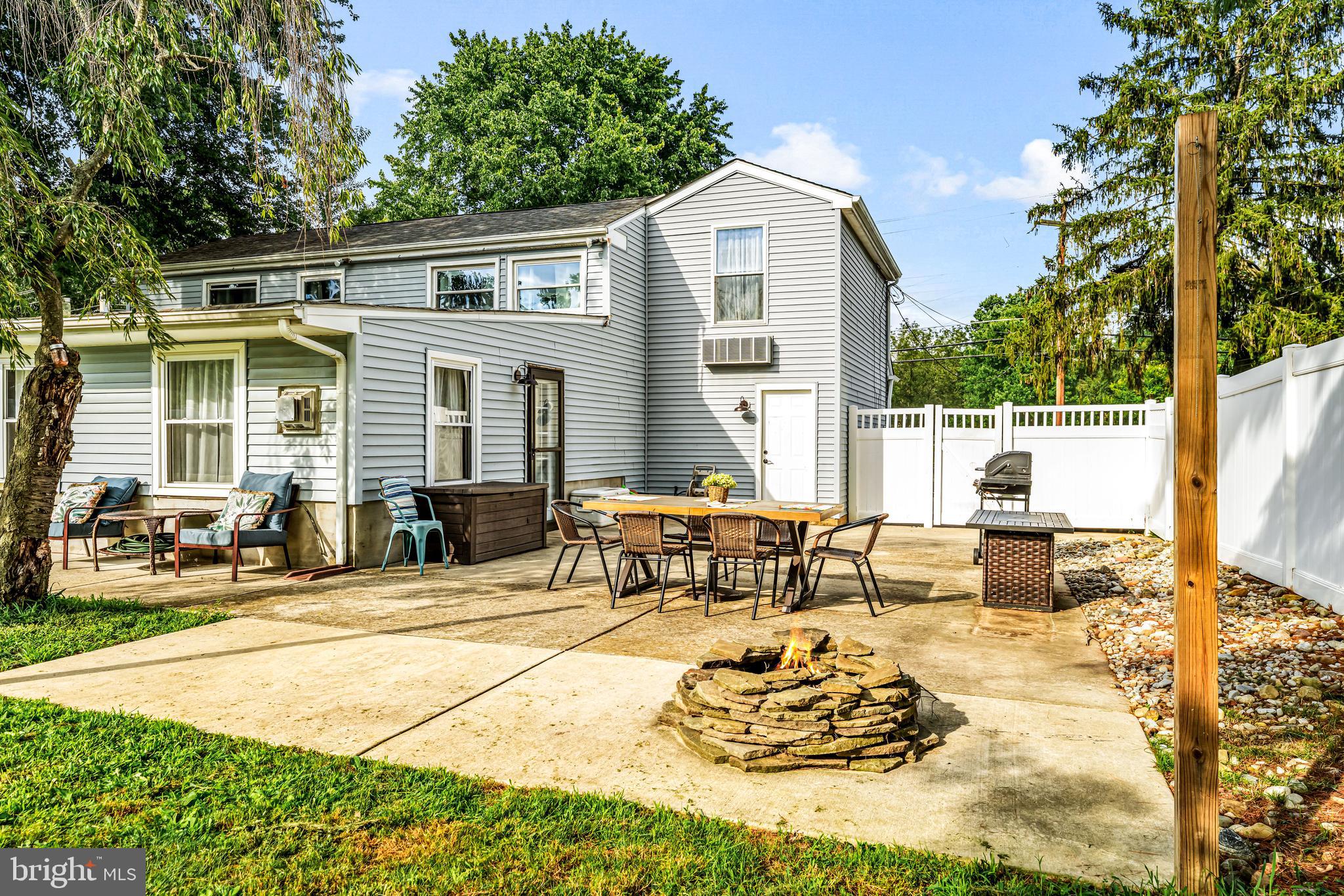 255 Jackson Road Mantua, NJ 08051 - Photo 29 of 34 a outdoor space with patio the couches and a dining table with chairs
