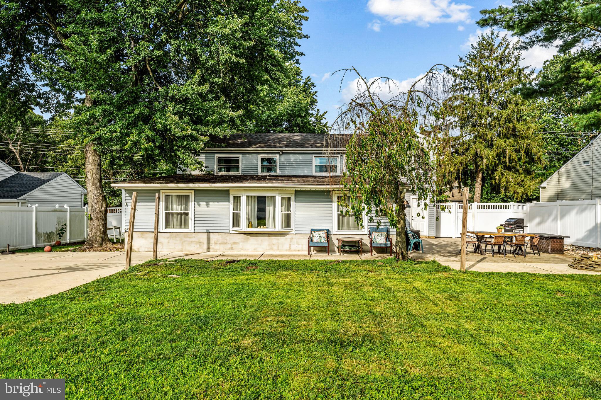 255 Jackson Road Mantua, NJ 08051 - Photo 33 of 34 a front view of a house with a yard and sitting area