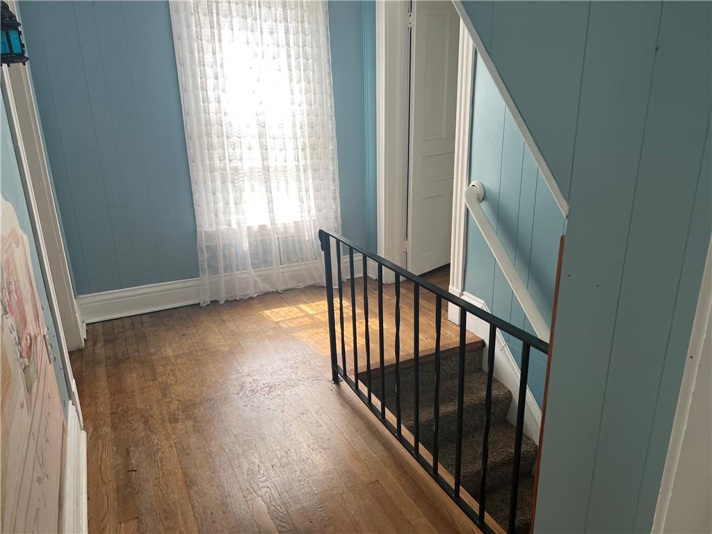 802 4th Street Rochester, PA 15074 - Photo 11 of 31 a view of a hallway with wooden floor and staircase