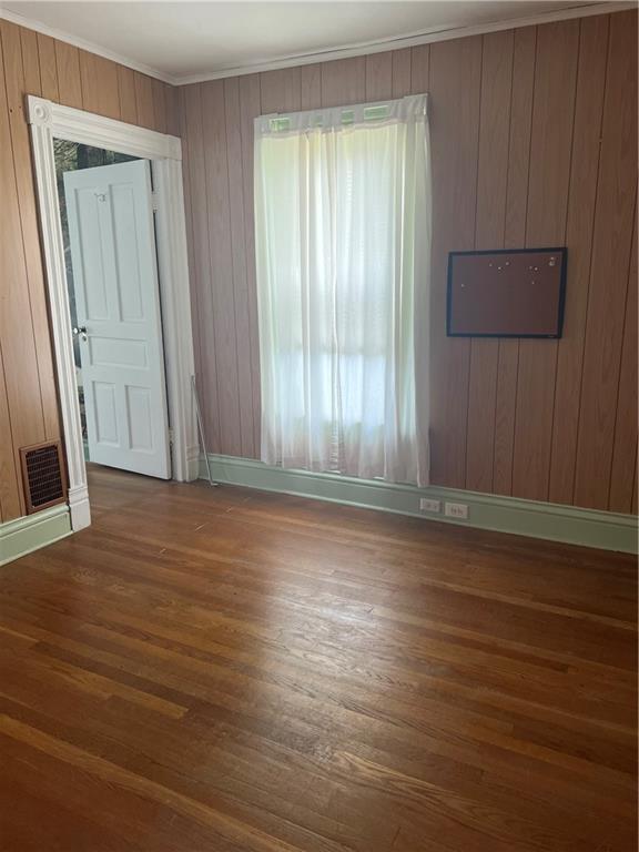 802 4th Street Rochester, PA 15074 - Photo 16 of 31 an empty room with wooden floor and a window