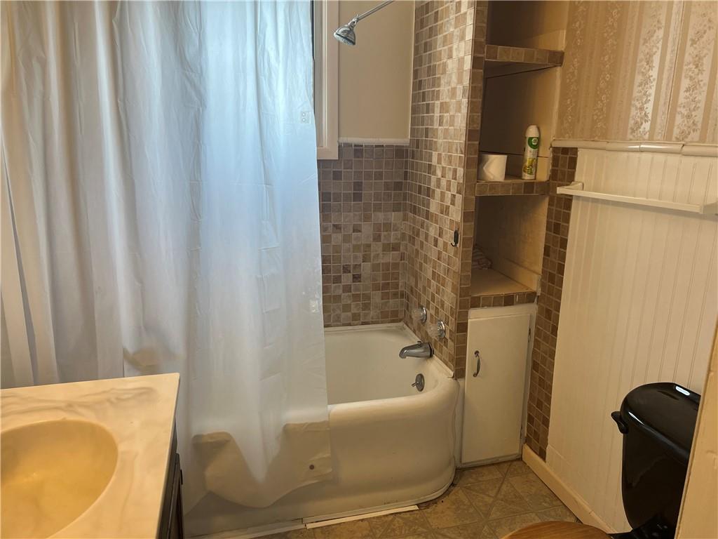 802 4th Street Rochester, PA 15074 - Photo 19 of 31 a bathroom with a bathtub and shower