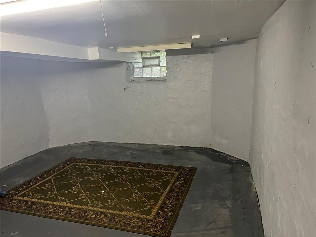 802 4th Street Rochester, PA 15074 - Photo 21 of 31 an empty room with wooden floor