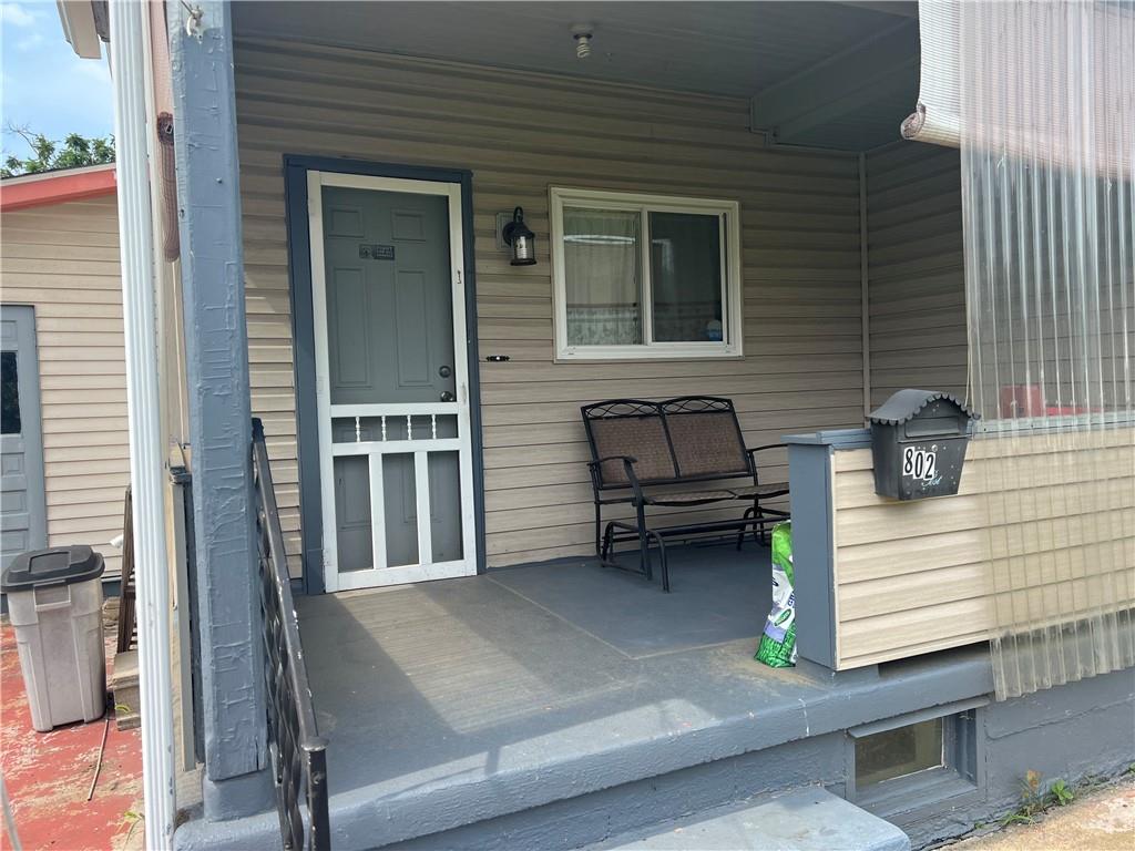 802 4th Street Rochester, PA 15074 - Photo 26 of 31 a view of a patio with a table and chairs