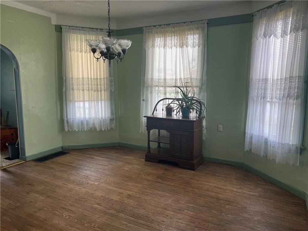 802 4th Street Rochester, PA 15074 - Photo 3 of 31 an empty room with windows and ceiling fan