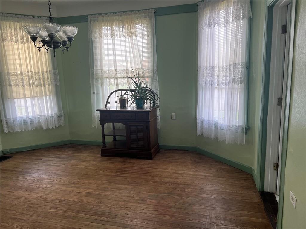 802 4th Street Rochester, PA 15074 - Photo 4 of 31 wooden floor in an empty room with a window
