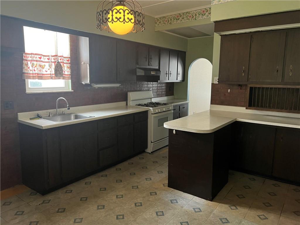 802 4th Street Rochester, PA 15074 - Photo 8 of 31 a kitchen with a sink cabinets and window