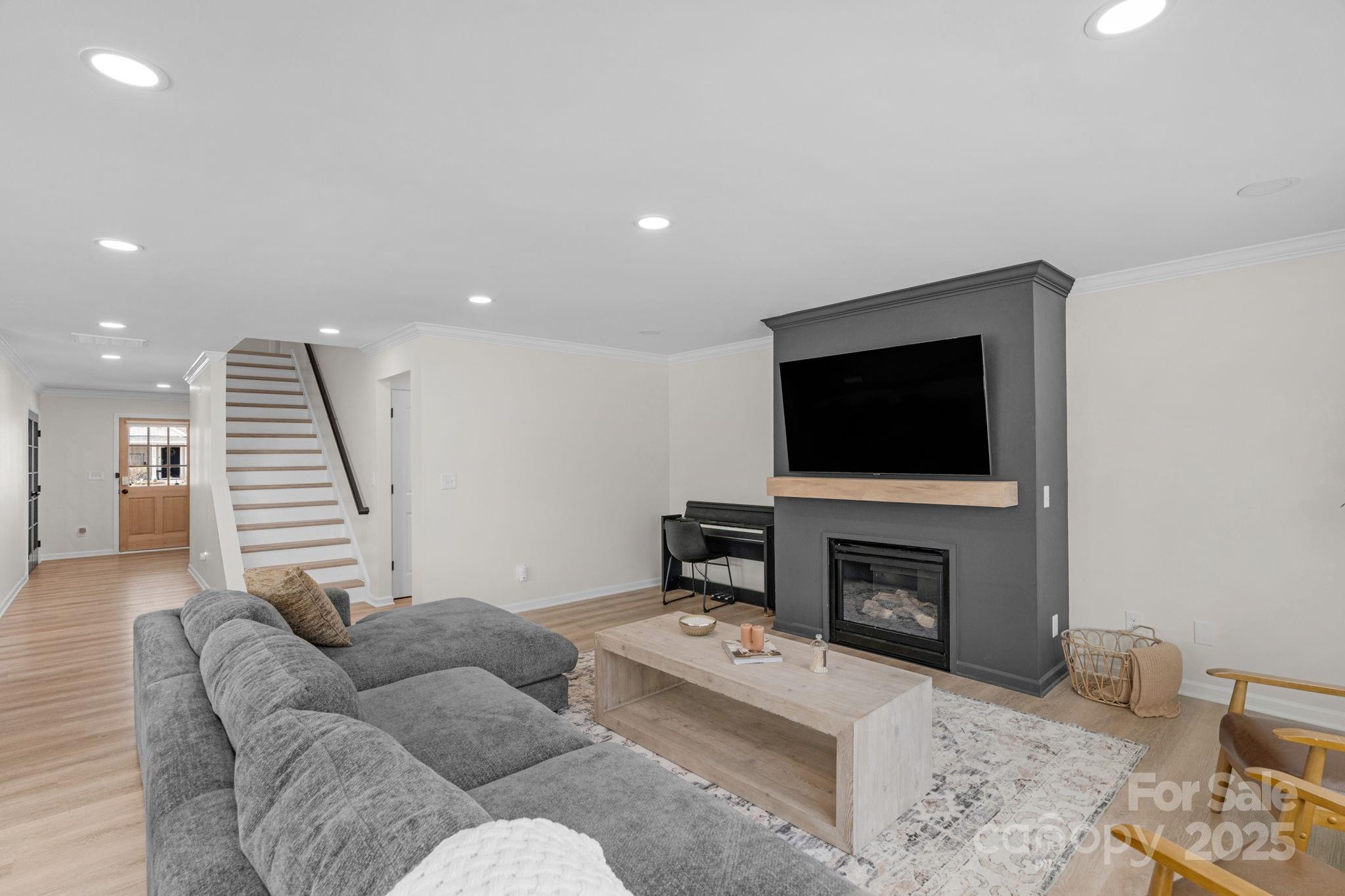 12847 Connemara Court Midland, NC 28107 - Photo 14 of 47 a living room with furniture and a flat screen tv