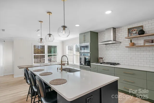 a kitchen with granite countertop a sink a center island and cabinets