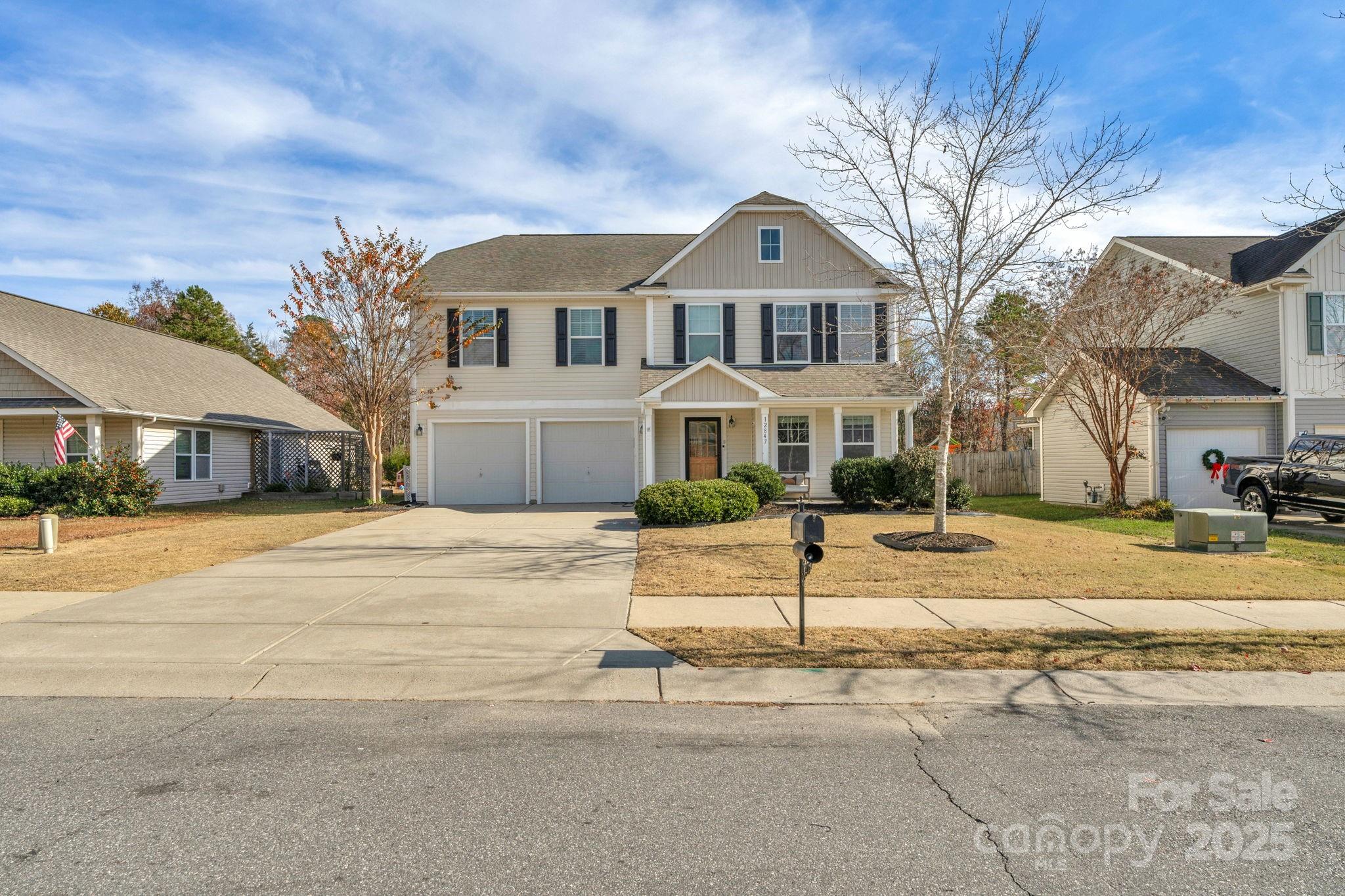 12847 Connemara Court Midland, NC 28107 - Photo 2 of 47 a front view of a house with a yard