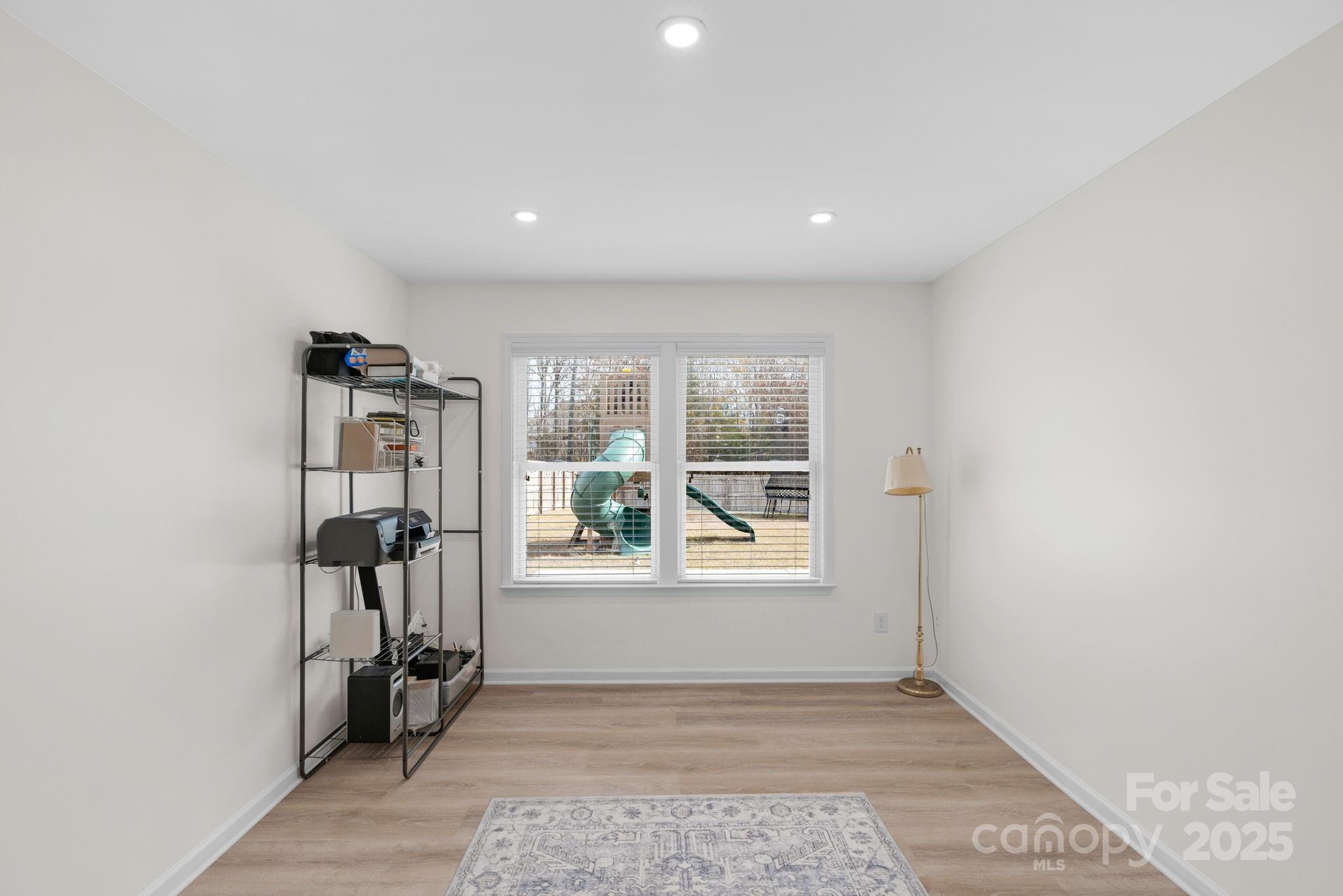 12847 Connemara Court Midland, NC 28107 - Photo 24 of 47 an empty room with windows