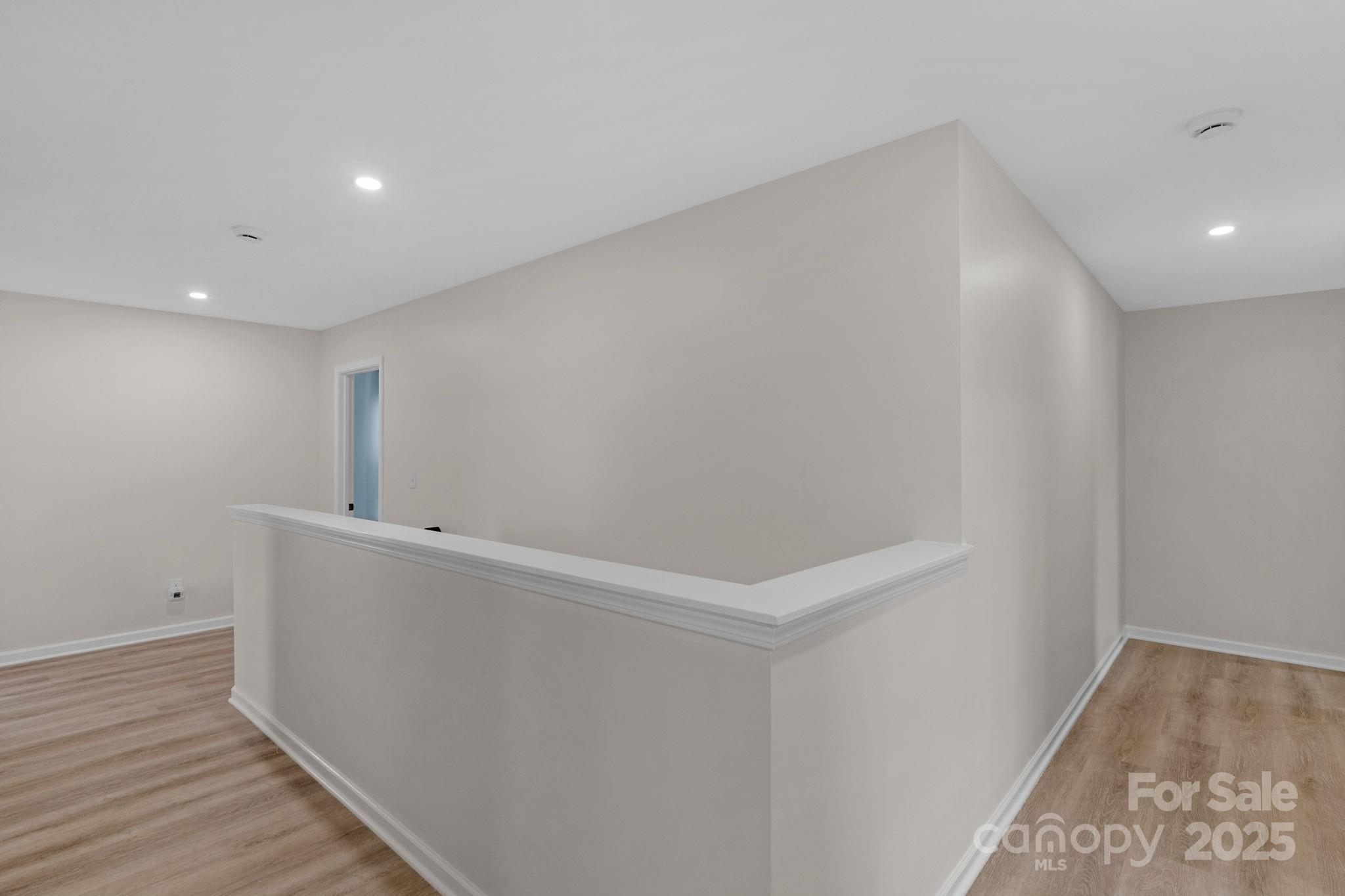 12847 Connemara Court Midland, NC 28107 - Photo 37 of 47 a view of hallway with wooden floor