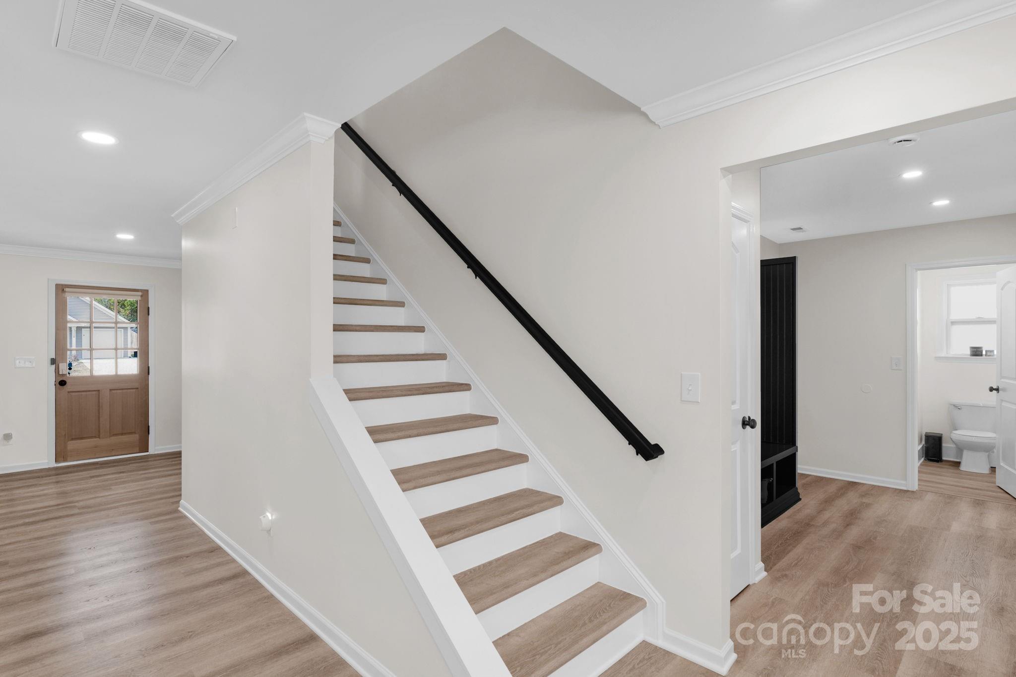 12847 Connemara Court Midland, NC 28107 - Photo 44 of 47 a view of a hallway with wooden floor and entryway