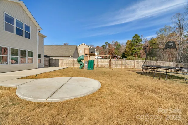 a view of a swimming pool with a house