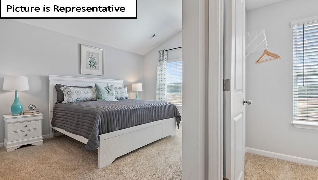 7012 North Mill Road Charlotte, NC 28216 - Photo 15 of 26 a bedroom with a bed and a window