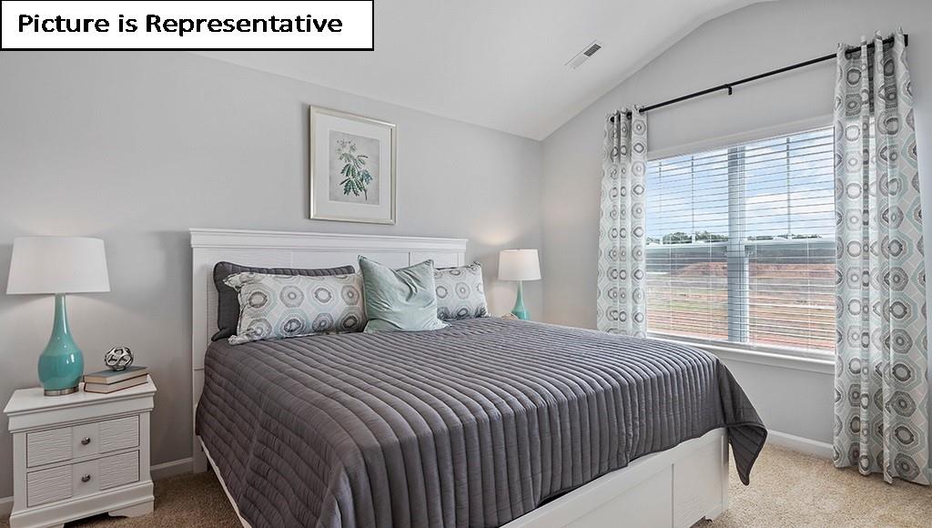 7012 North Mill Road Charlotte, NC 28216 - Photo 16 of 26 a bedroom with a bed and a window