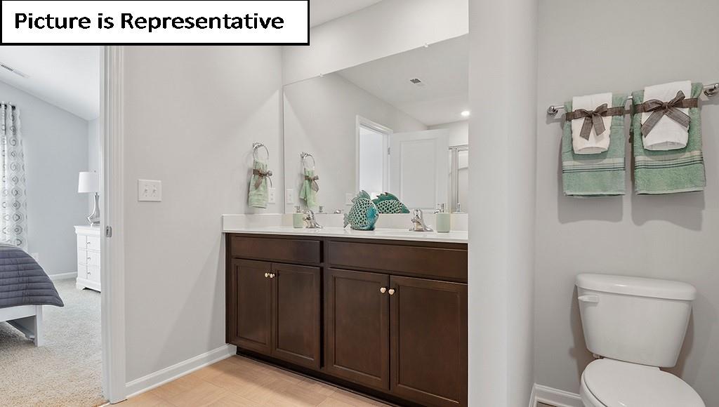 7012 North Mill Road Charlotte, NC 28216 - Photo 18 of 26 a bathroom with a sink and a mirror